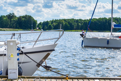 Yachts bow moored in a harbor. sailboats in the dock. summer vacations