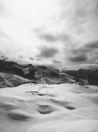 Scenic view of landscape against sky during winter