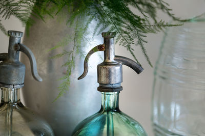 Close-up of glass bottle on table