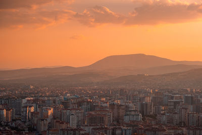 Cityscape against sky during sunset