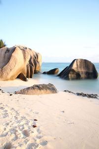 Scenic view of beach against clear sky