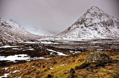 Scenic view of snowcapped mountains against sky