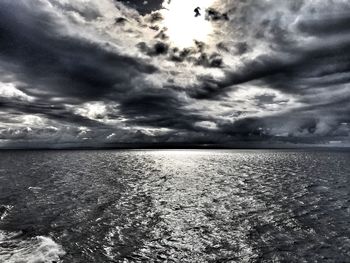 Scenic view of sea against cloudy sky