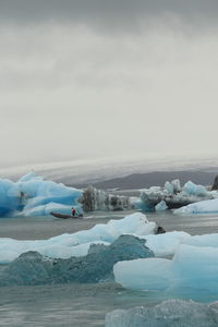 Scenic view of frozen sea against sky