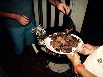 Midsection of woman holding food