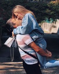 Rear view of couple holding hands