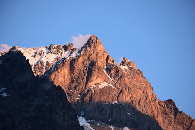 Scenic view of mountains against clear blue sky