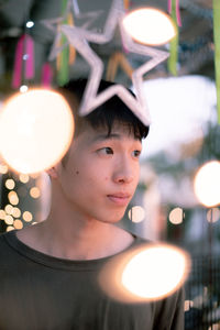 Portrait of man with illuminated lights