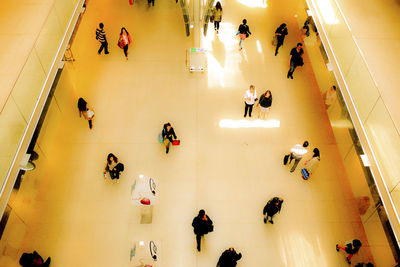 High angle view of people in shopping mall at station