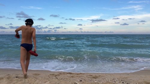 People standing on beach