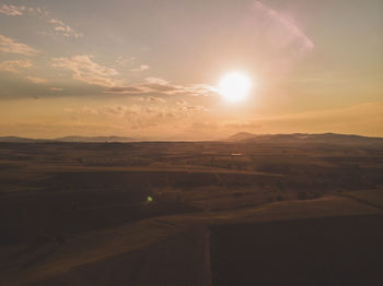 Scenic view of landscape against sky during sunset