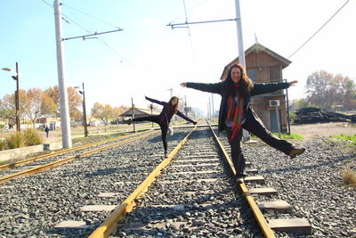 Full length of woman standing by railing