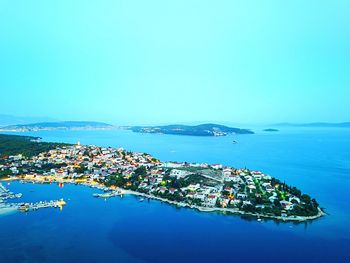 High angle view of sea against clear blue sky