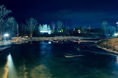 View of illuminated street lights at night