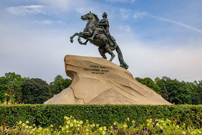 Low angle view of statue against sky