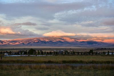 Scenic view of field against sky during sunset