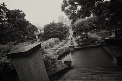 High angle view of staircase by building against sky