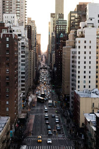 Road amidst buildings in city