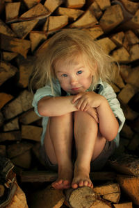 Portrait of cute girl sitting outdoors