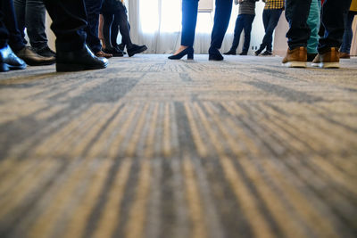 Low section of people on carpet
