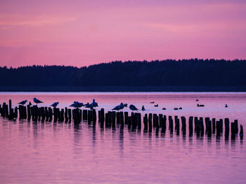 Scenic view of lake against sky during sunset