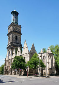 Low angle view of historic building against clear blue sky