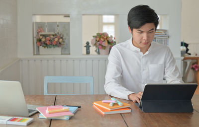 Man using laptop on table