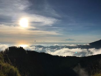 Scenic view of silhouette mountains against sky at sunset