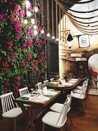 Empty chairs and tables in restaurant