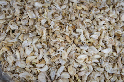 Full frame shot of garlics for sale in market