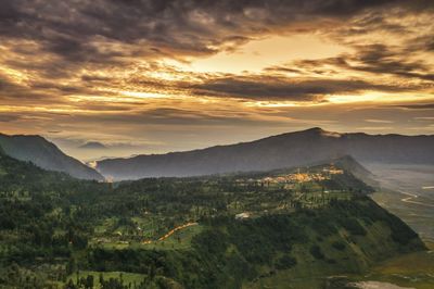 Scenic view of mountains against sky during sunset