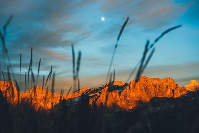 Scenic view of mountains against sky at sunset