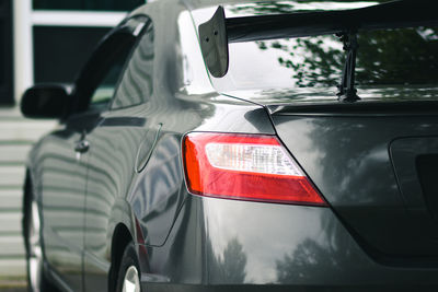 Reflection of man in car mirror