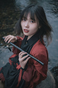 Portrait of young woman looking away