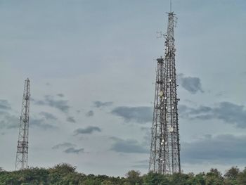 Low angle view of communications tower against sky