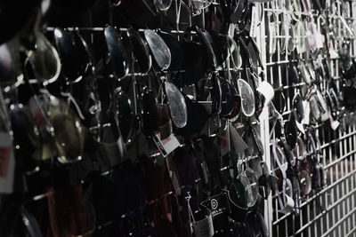 Full frame shot of wine bottles on rack