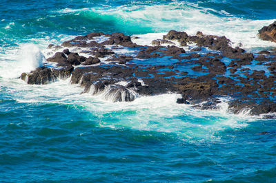 Scenic view of sea against blue sky