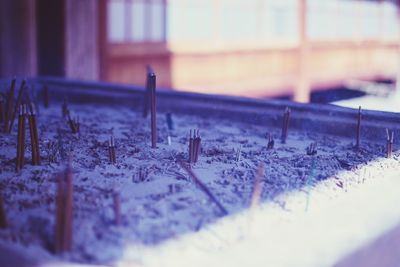 Close-up of snow on window of building