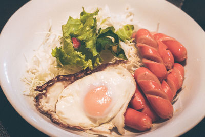 Close-up high angle view of breakfast consisting of fried egg