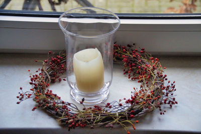 High angle view of candle on window