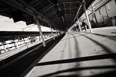 People waiting at railroad station platform