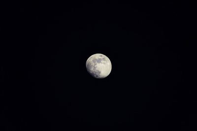 Low angle view of moon against sky at night