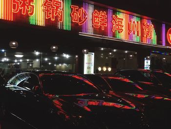 View of car on illuminated city at night
