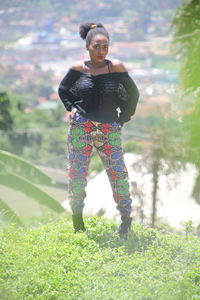 Full length of woman standing on field