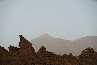 Scenic view of rocky mountains against clear sky