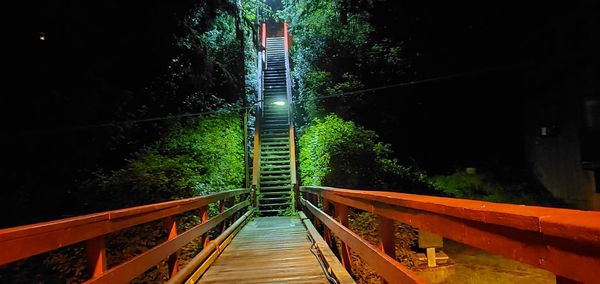 Footbridge over footpath at night