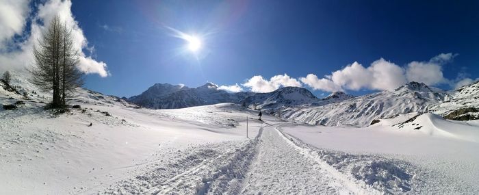 Scenic view of snowcapped mountains against sky