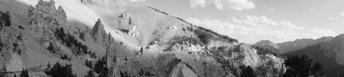 Panoramic view of snowcapped mountains against sky