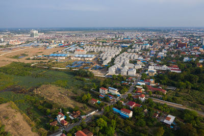 High angle view of city buildings against sky