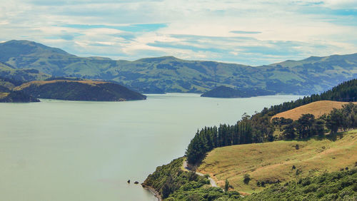 Scenic view of landscape and mountains against sky